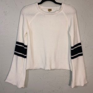 White sweater with navy detail on sleeves